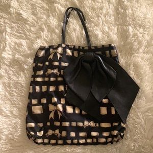 Designer black and gold Valentino back.